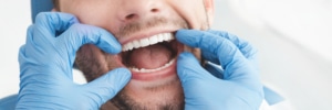 Man having teeth examined at dentists