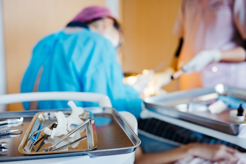 Close-up of dental tools during oral surgery in Austin, TX