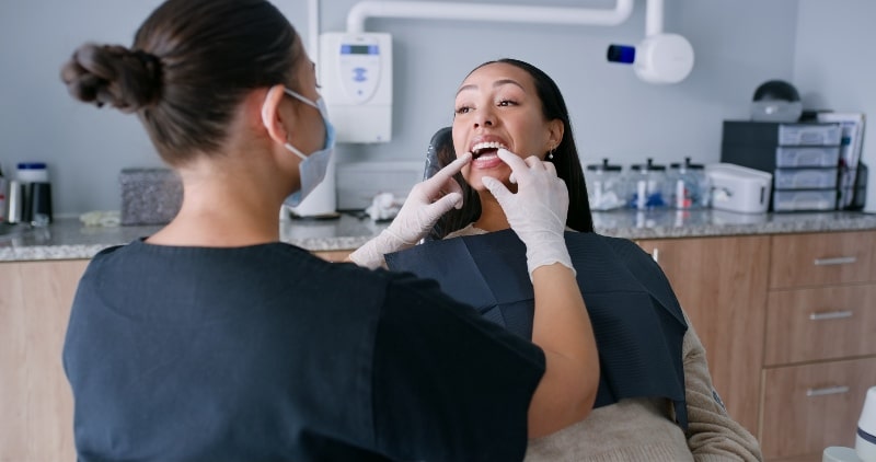 Dentist and patient consulting for oral surgery in Austin, TX