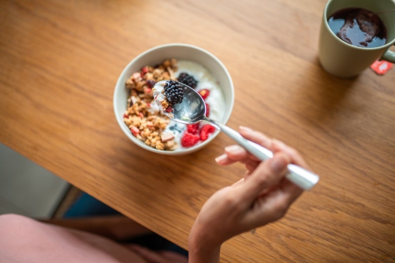 Healthy breakfast of yogurt parfait, granola and fruit in Austin, TX
