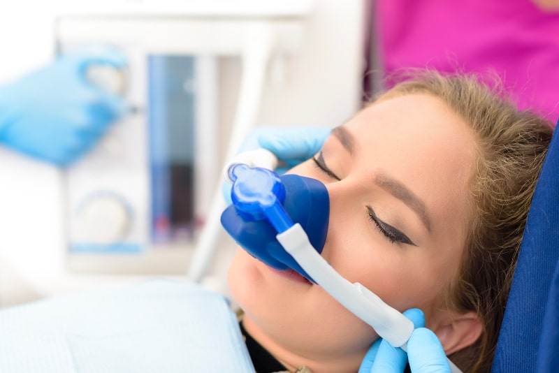 Woman with inhalation sedation at dentist in Austin, TX