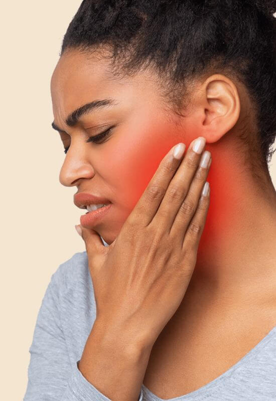 Woman with tooth pain in Pflugerville & Central Austin, TX